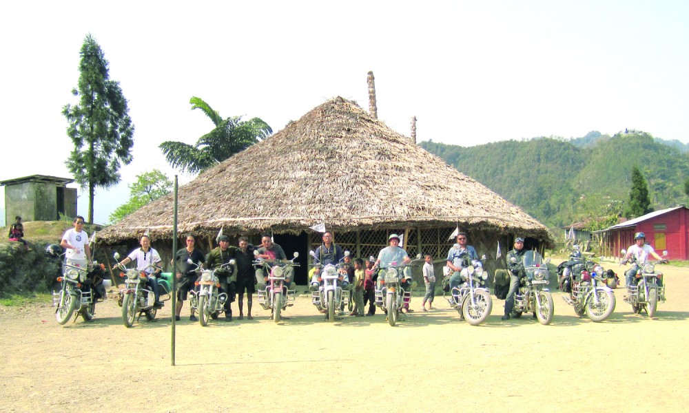 The Royal Enfield Riders pose for the lens outside the Anghs residence in Longwa, Mon district.